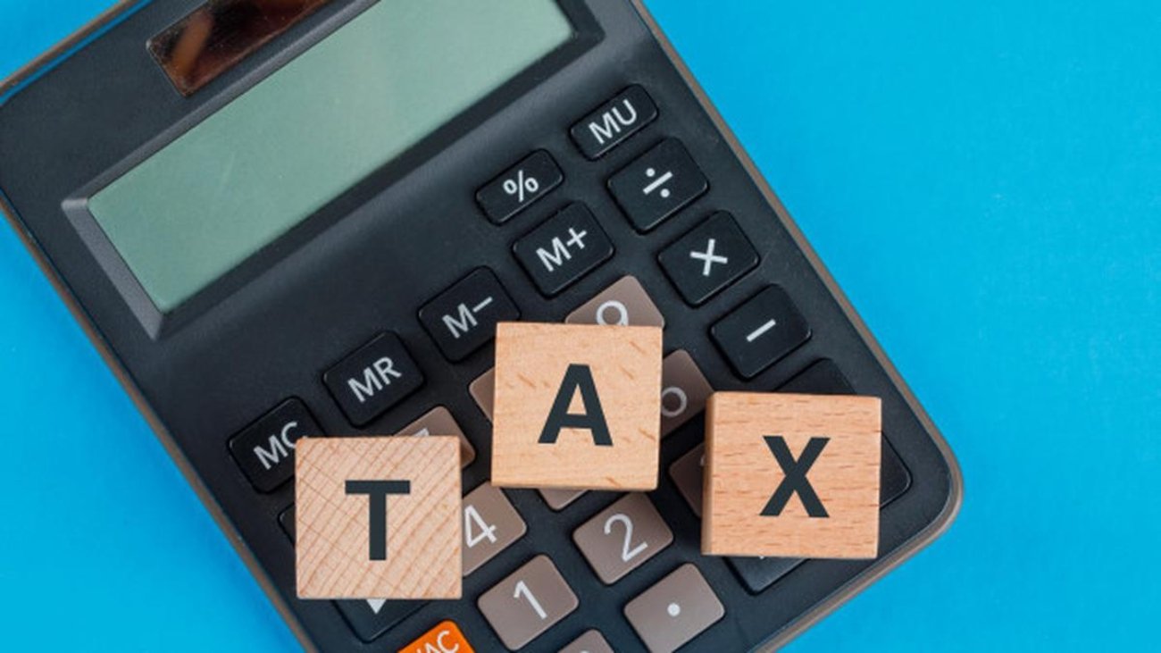 1793428804_044002400_1614227023-tax-planning-concept-with-wooden-cubes-calculator-blue-table-flat-lay_176474-9519.jpg